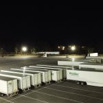 trucks in a parking lot at night