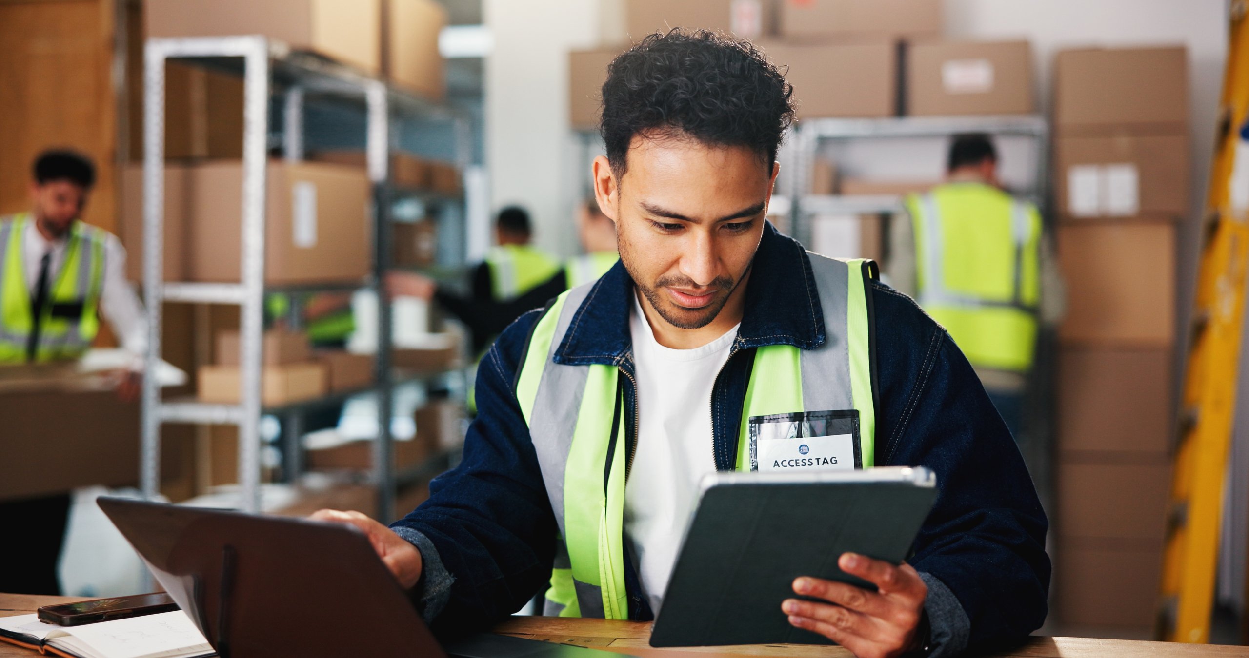 Logistics, man and tablet in warehouse with laptop, shipping email or courier app to track package. Supply chain, person and reading in depot with tech, dispatch and delivery update for online order.