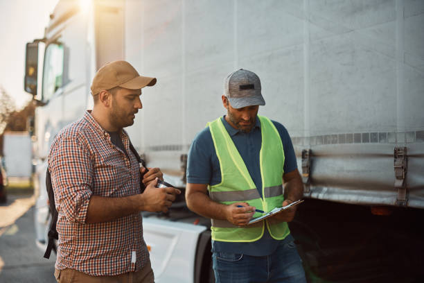 two men outside of truck